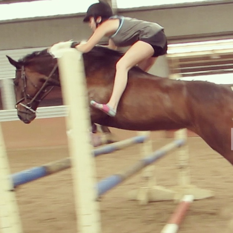 Jenna & Dreamer jumping an oxer bareback